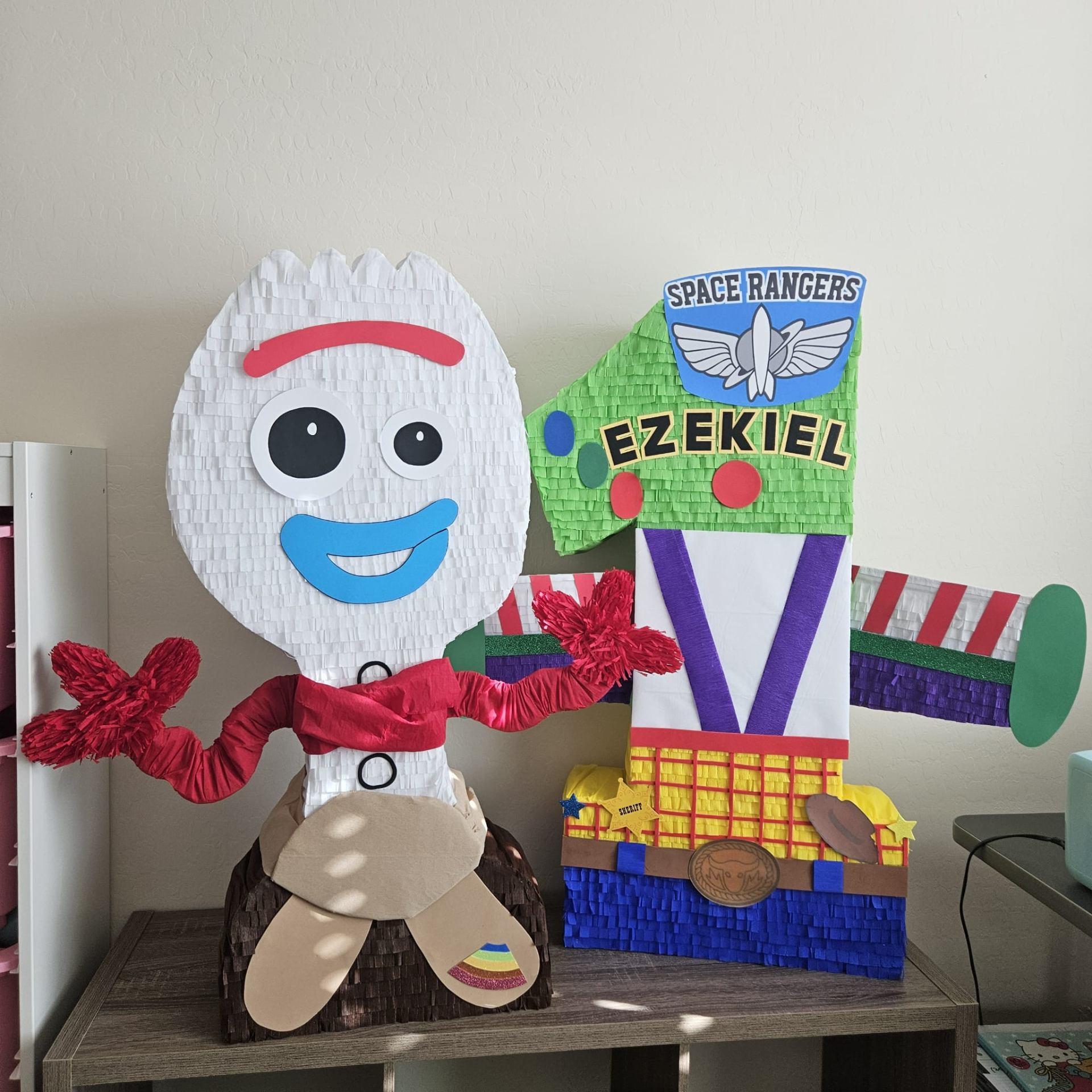 Toy Story Forky and Buzz Lightyear piñatas for Ezekiel