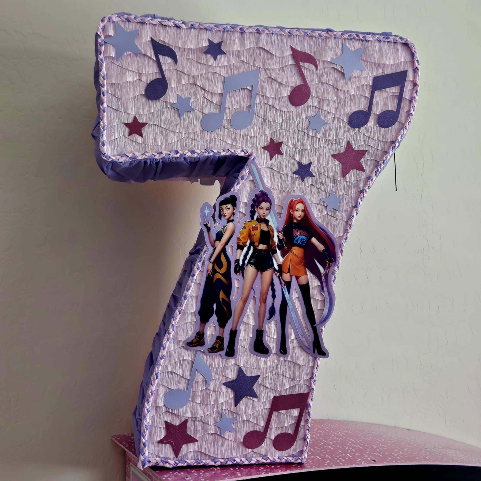 K-Pop Demon Hunters themed number 7 piñata in lavender and purple